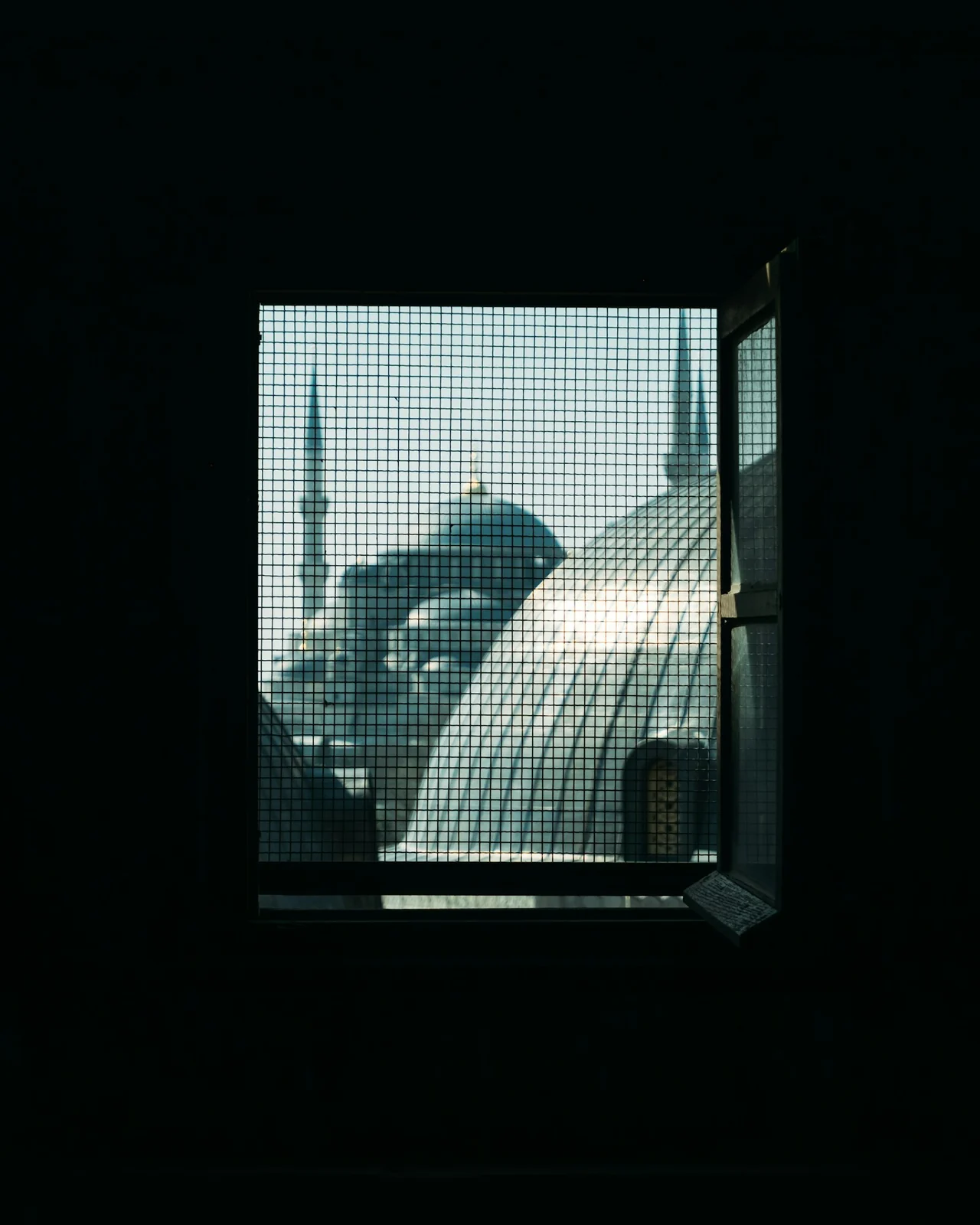 A mosque seen through a window